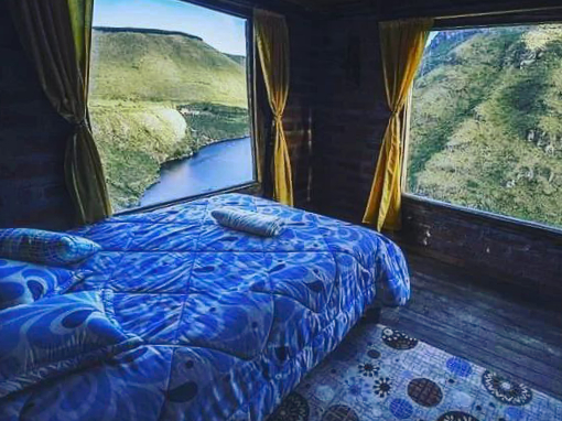 Queen Bedroom at Tambo Condor's Casa del Aire A Queen Bed with a view at the Casa del Aire, Tambo Condor