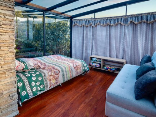 Queen bed and Sofa in family room Queen bed and sofa in alcove of a family room at Tambo Condor