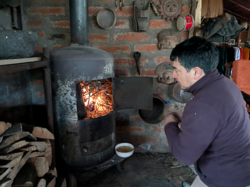Vladimir lighting a fire in the potbelly stove at Tambo Cóndor’s main lodge. Vladimir lighting a fire in the potbelly stove at Tambo Cóndor’s main lodge.